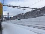 (148'795) - Viel Schnee beim Bahnhof in Airolo am 9.